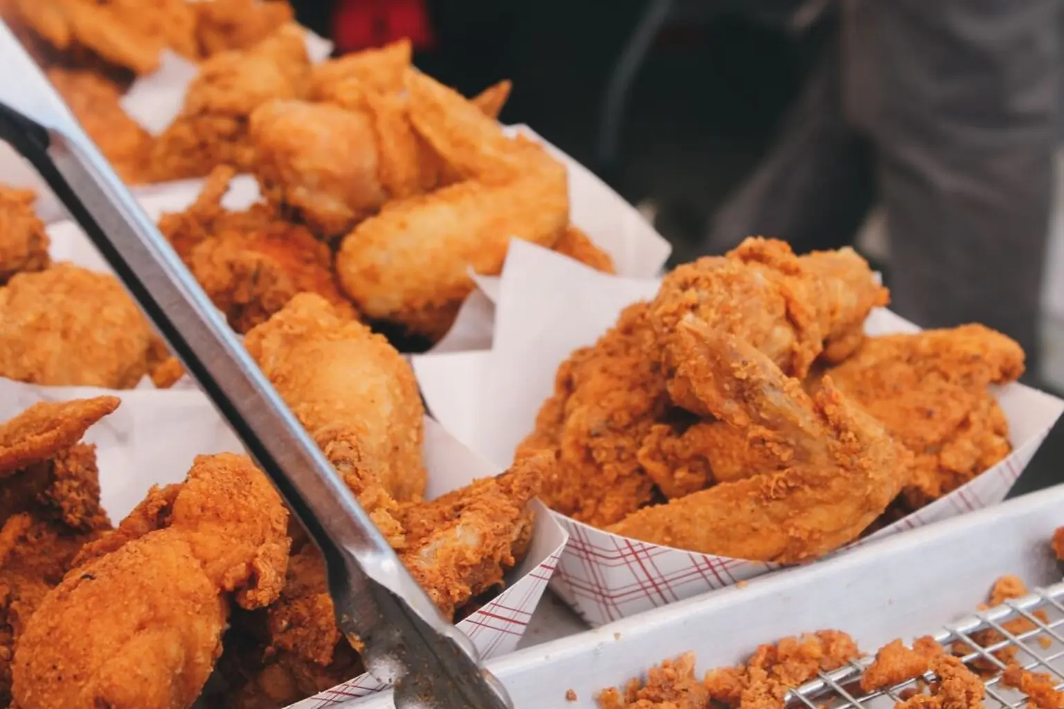 Trays of freshly prepared fried chicken